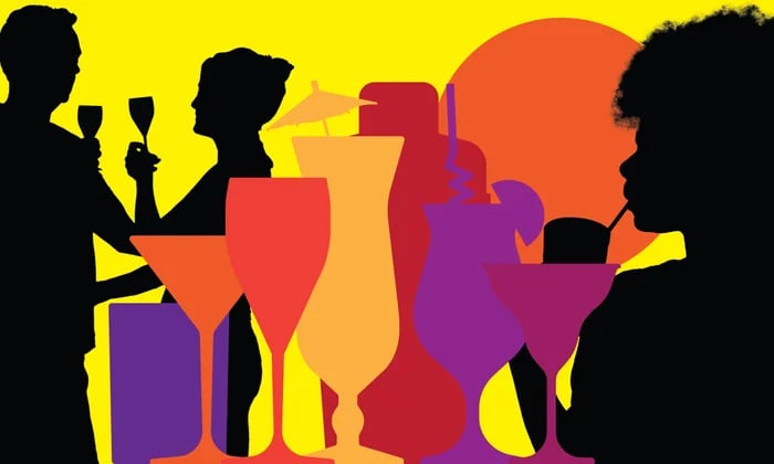 a group of people standing around a table