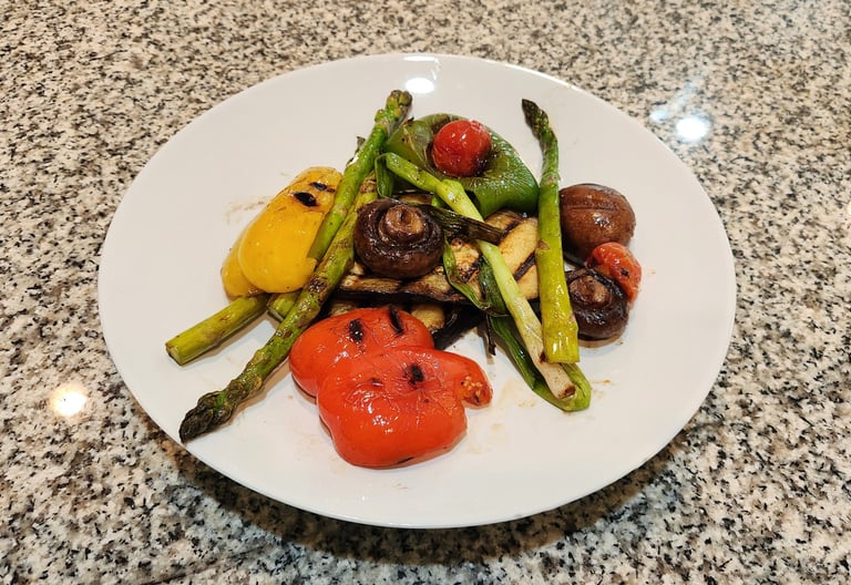a plate on a counter with grilled vegetables