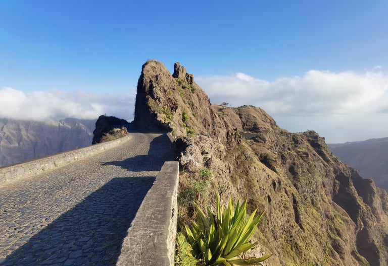 Historic cobblestone road winding through the volcanic mountain peaks of Santo Antão, Cape Verde.