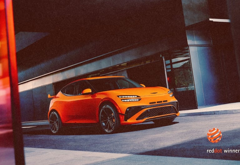 A bright orange Genesis GV60 Magma concept electric SUV parked in front of a modern building.