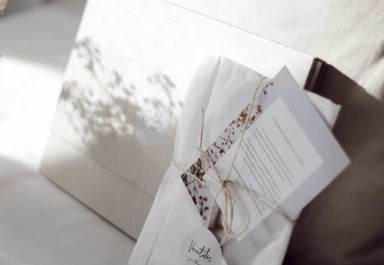 a small bouquet of flowers and a card with a notepad