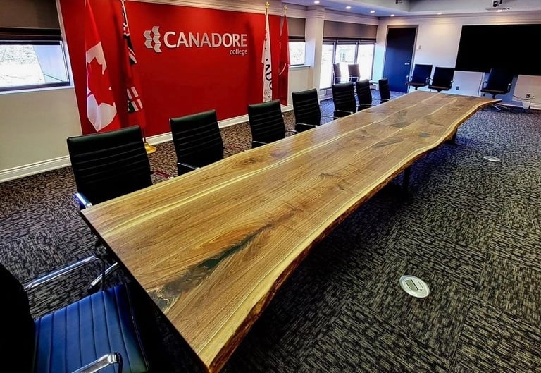 20ft x 4ft custom maple boardroom table built for Canadore College — installed view