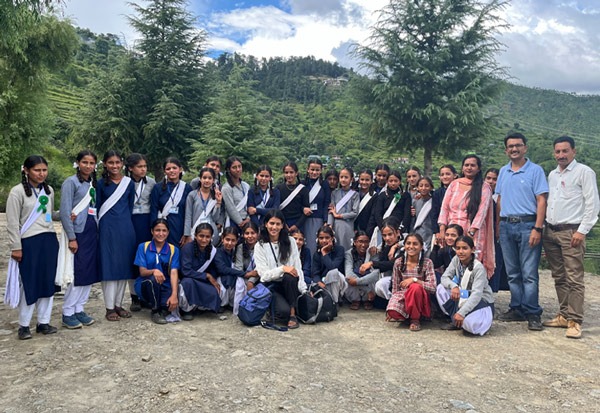 Group or schoolgirls outside with Ambassador Pooja C.