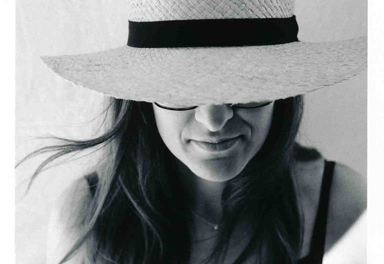 An analogue picture of a woman wearing a hat. Creator: Slawek Dejneka