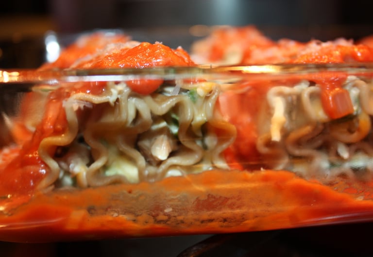 chicken cheese lasagna noodles covered in basil tomato sauce