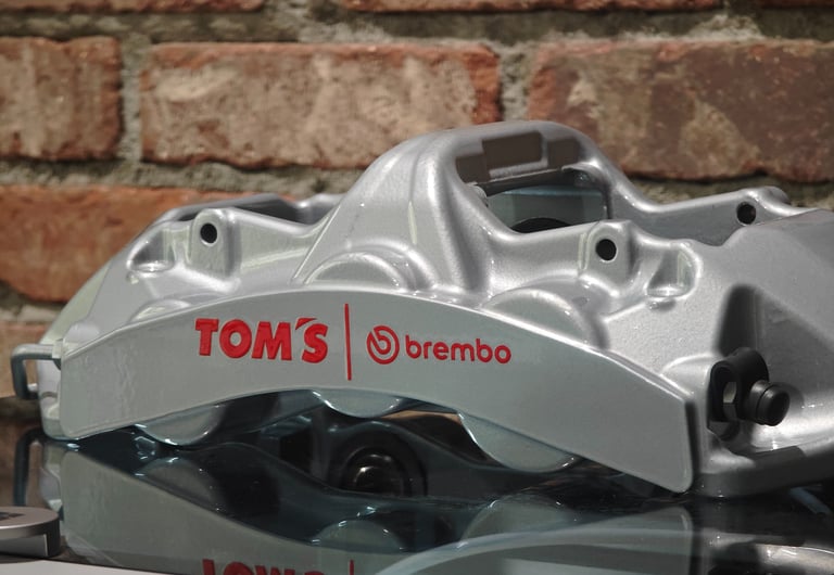 Tom's Brembo GT calipers powder coated in Porsche Silver