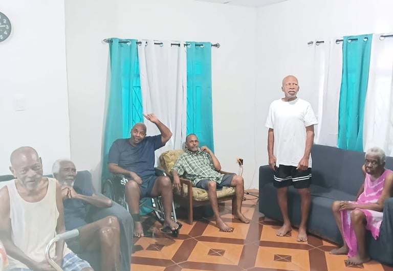 Elderly people resting and socializing in a communal living room at a senior care home.