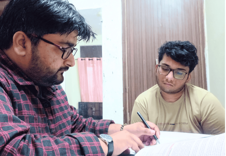 Male private teacher is giving personal attention to a student