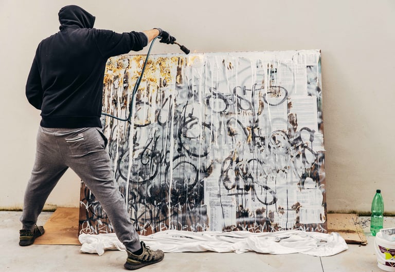 Kende painting in studio — artist at work on large format calligraphy panel