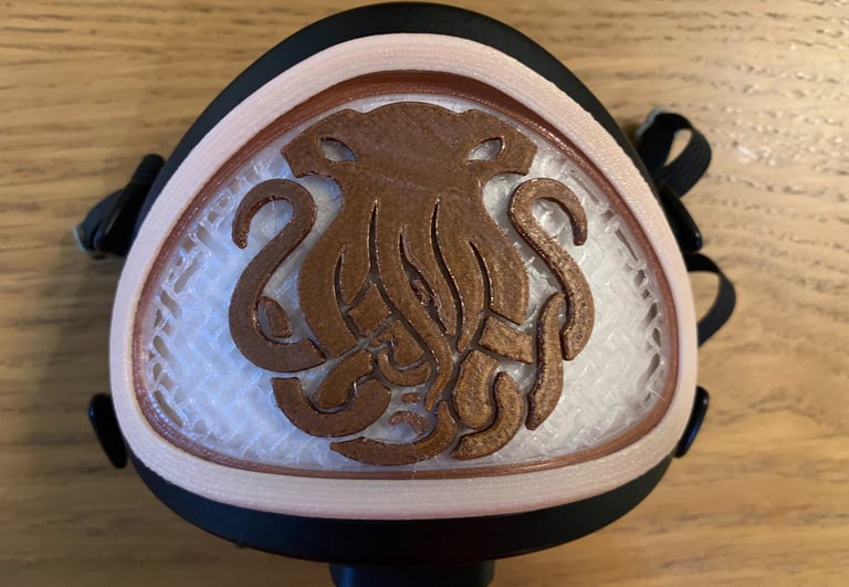 flo-32: Flomask with closed InkFish logo decoration