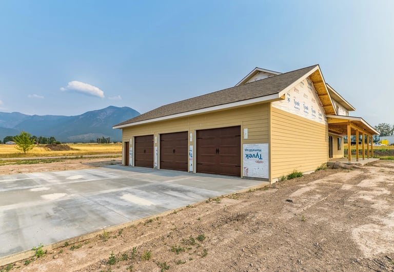 Three car garage of a custom luxury home in western Montana by Saddle Horn