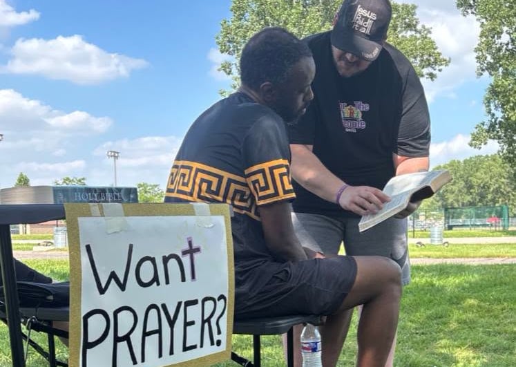 offering prayer in the community park, Taylor, MI