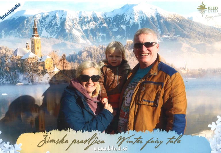 Cheesey family picture from touristy photo booth of Lake Bled in Winter
