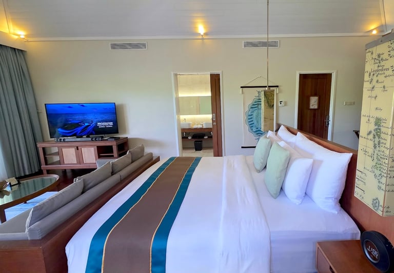 Hurawalhi Maldives beach pool villa bedroom