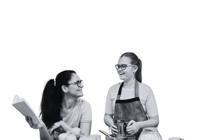 Two young people cooking in the kitchen