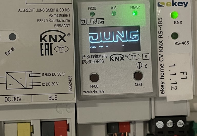 Jung KNX IP Interface IPS300SREG and ekey home CV smart home automation modules installed in an electrical panel.