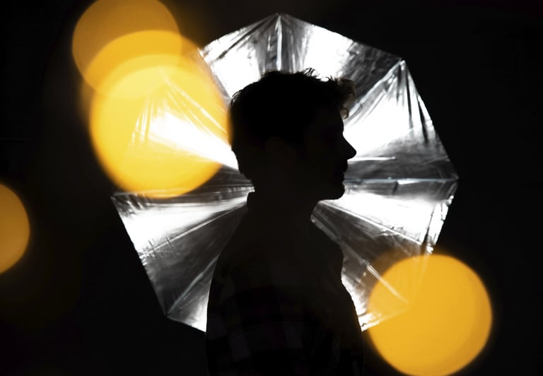 a person holding a umbrella in the dark