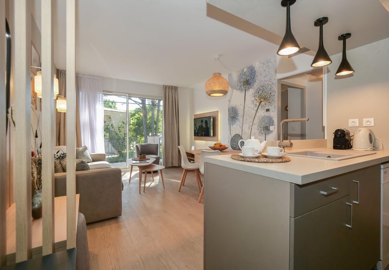 a kitchen with a table and chairs and a couch