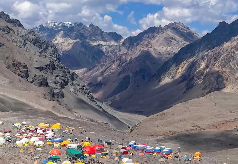 a mountain scene with tents and tents and tents