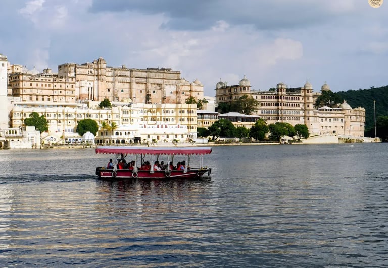 Boat ride on Lake Pichhola with City Palace Udaipur in the background.