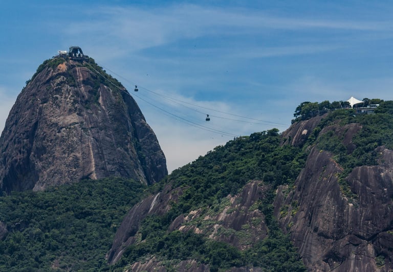 cable car going up a mountain with a cable car going up the mountain, Pão de Açucar, Rio de Janeiro