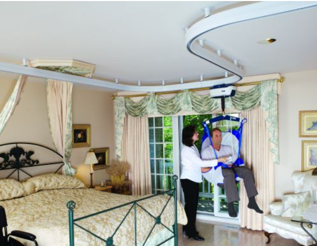Overhead track system helps man move around his home