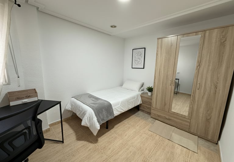 Habitación individual moderna con escritorio