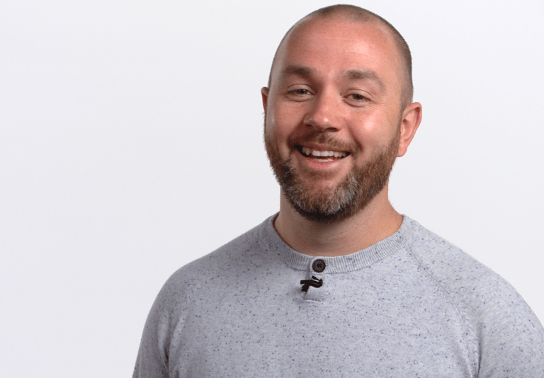 Stephen Long, smiling at the camera, on a white background