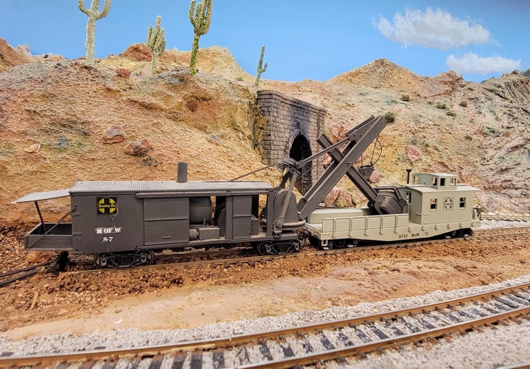 Maintenance of Way for Santa Fe Railroad.  A steam driven crane and work train caboose.