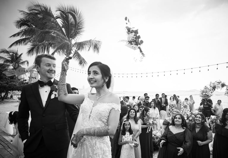 a bride and groom are standing in front of a crowd of people