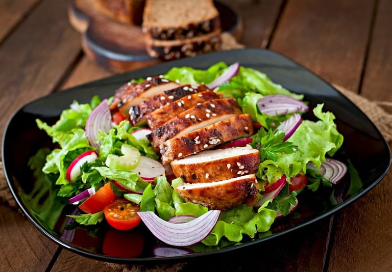 a plate of food with meat and vegetables