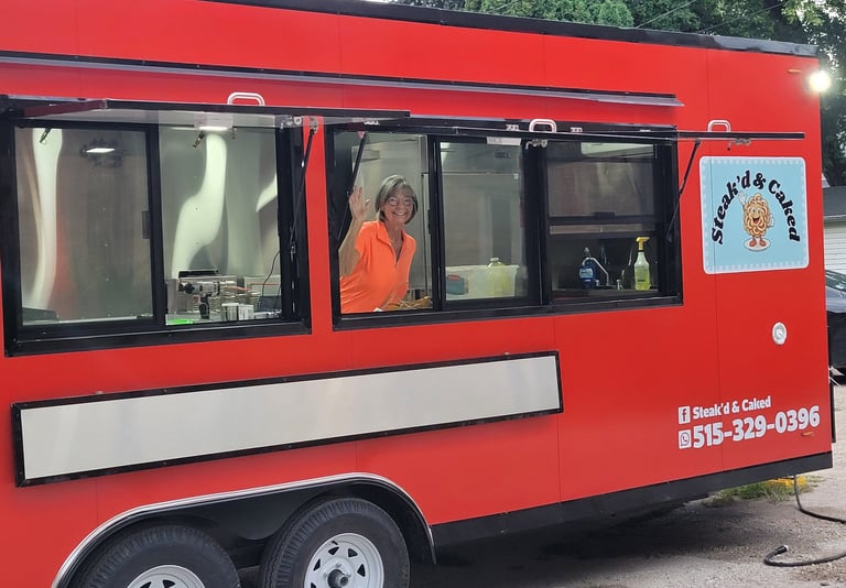Cindy Niemier at serving window inside food trailer