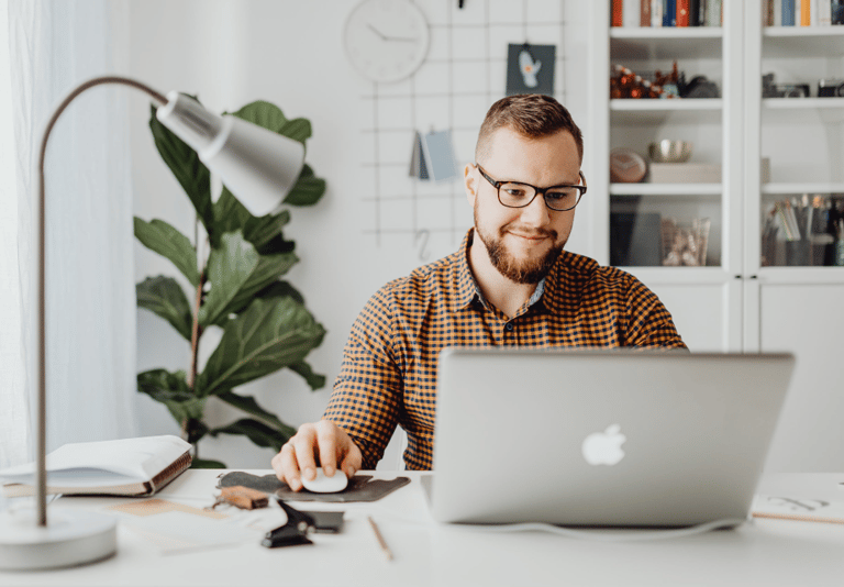 man in front of laptop at desk