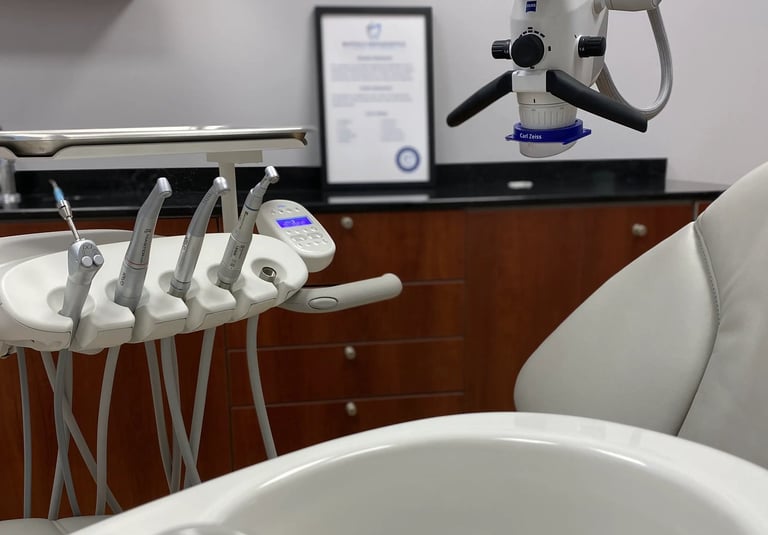 a dental room with a sink and a microscope