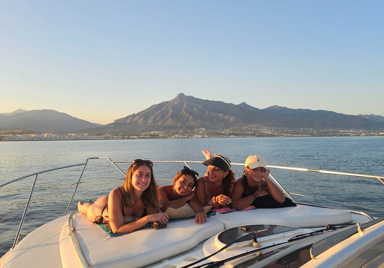 three girls on a boat in the ocean