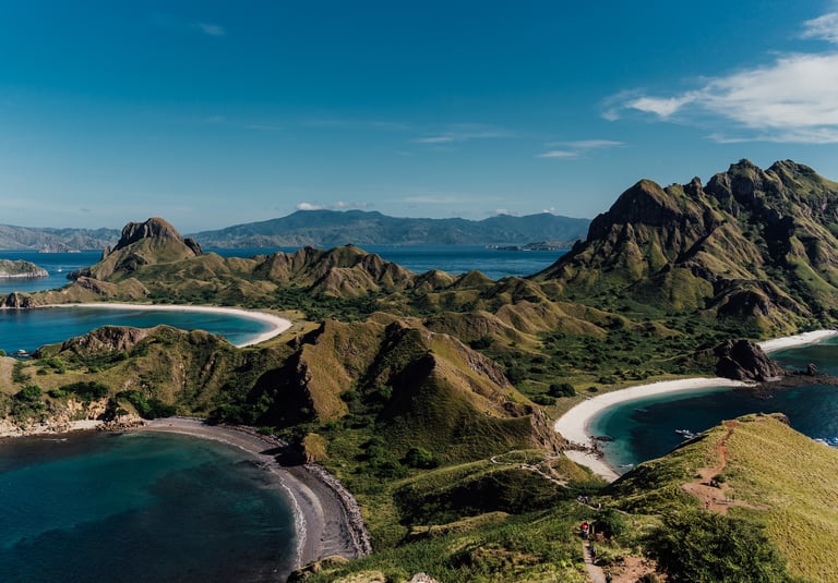 a view of a beach with a mountain in the background