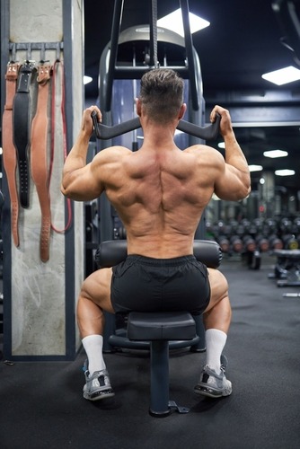 a man doing a back press exercise on a bench