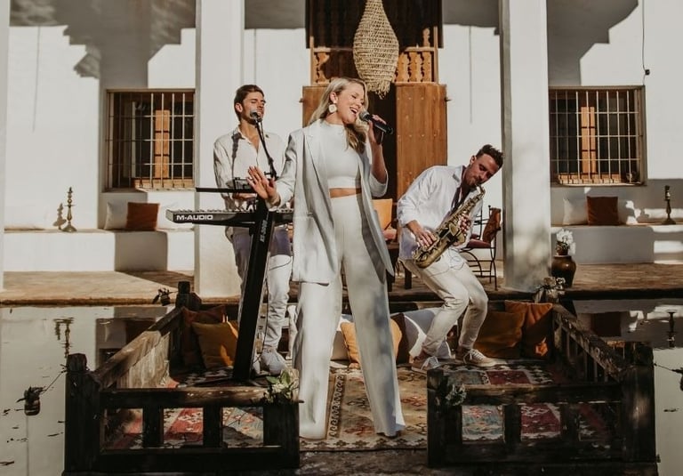 Live wedding band performing sophisticated cocktail hour music for a luxury destination wedding in I