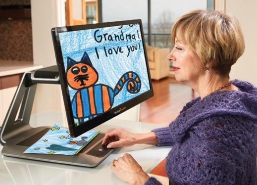 legally blind woman with amblyopia using enhanced vision acrobat magnifier reading for the blind