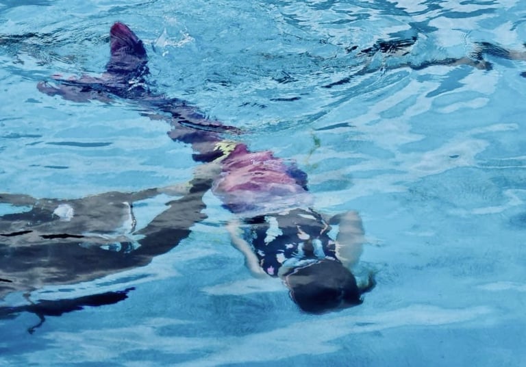Mermaid learning to swim