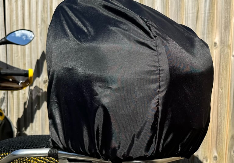 Motorsport helmet snugly secured inside a Remy fleece-lined helmet bag, showcasing soft interior