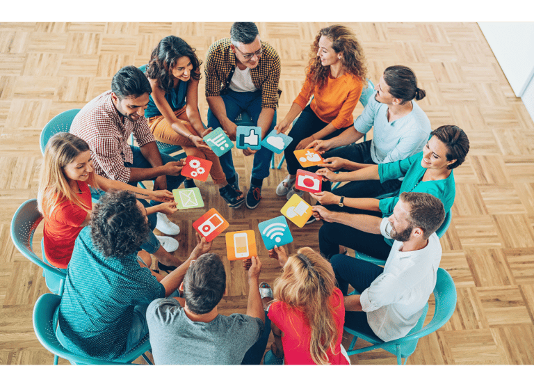Team of social media experts sitting around a table discussing strategy and content planning