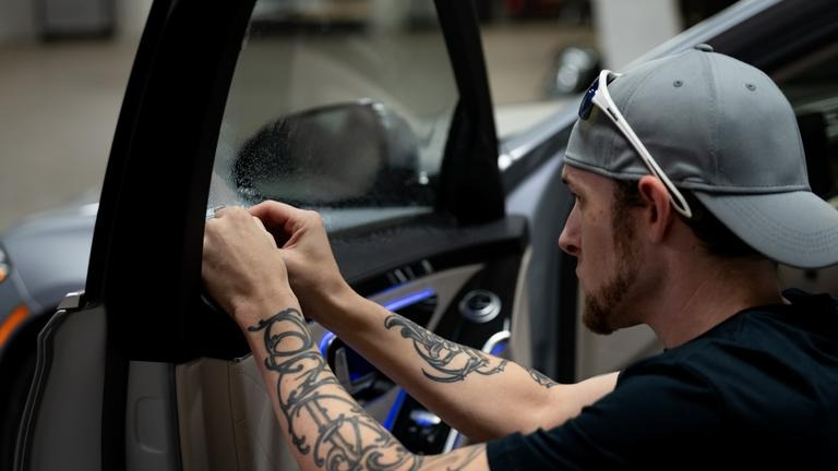 window tint being applied