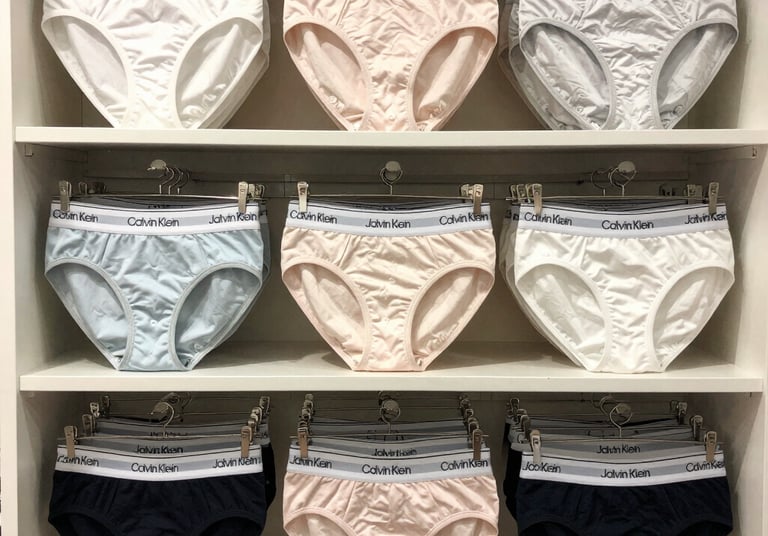 A close-up of a delicate lace bra in soft pastel tones, highlighting intricate stitching and comfort.