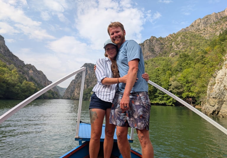 Don and Samantha on the bow of a boat in Matka Canyon in North Macedonia 