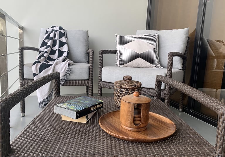 a wicker chair with a book and a book