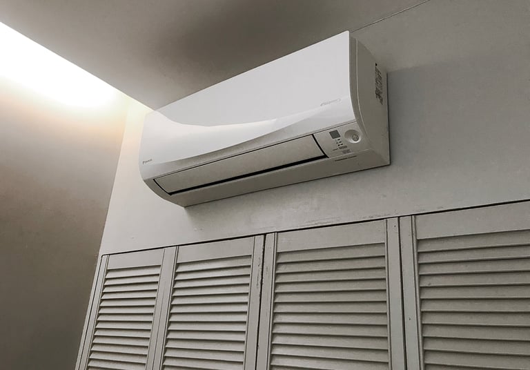 a white air conditioner with a white air conditioner