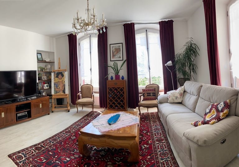 a living room with a couch and a television