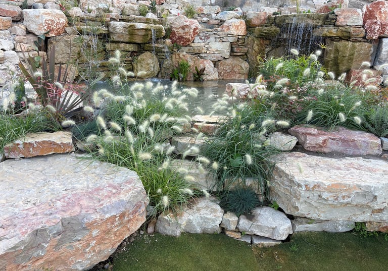 Natural stone steps lead to plunge biopool with waterfalls & adjacent lily pond in Lisbon/Aqua Vitae