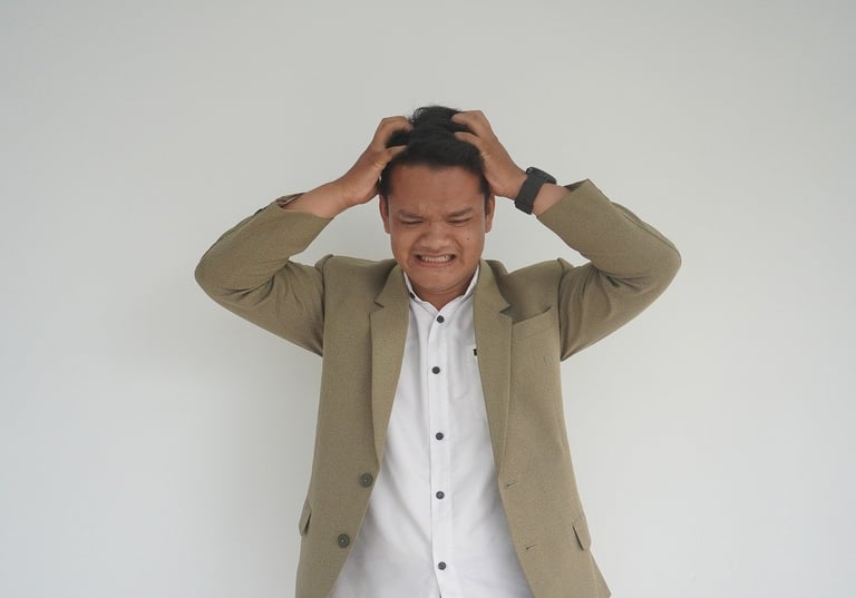a man in a suit and white shirt